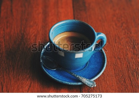 hot coffee on wooden table texture.
