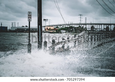 Water coming over the streets in Kemah during Hurricane Harvey  Royalty-Free Stock Photo #705297394