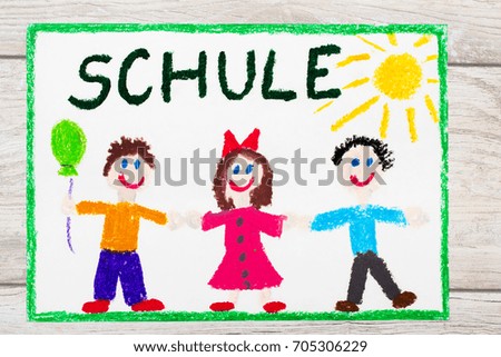 Photo of  colorful drawing: German word SCHOOL and happy children. First day at school. 