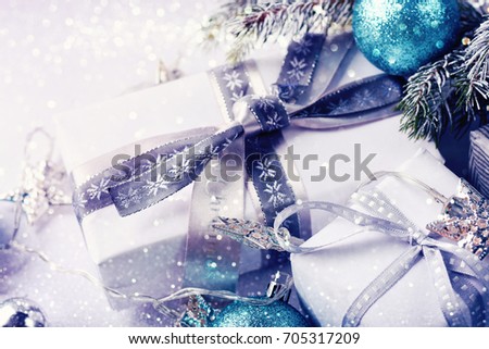 Christmas decoration with gifts on white shiny background