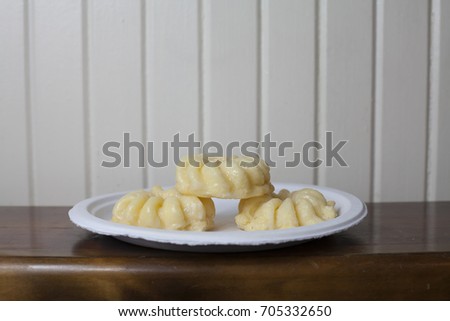 Close up of three sweet donuts on a plate