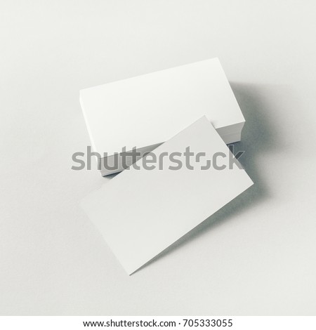 Photo of blank business cards on paper background. Mockup for ID.