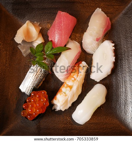 Sushi topped with variety raw ingredient including fish, ikura or salmon roe, shrimp, ika or squid, and tako or octopus