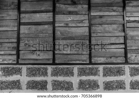  Old wooden plank and brick pattern. Antique rough and rustic fence of rural house in black and white