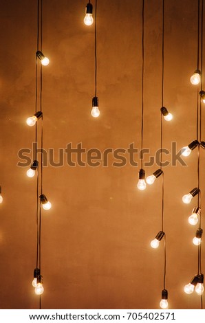 garland of edison lamps on a wooden background