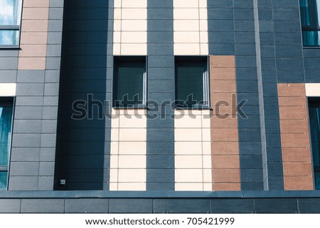 Modern Wall. Abstract architectural pattern with dark toned windows