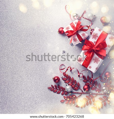 Christmas gifts and decoration on white shiny background