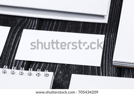 Corporate branding mockup template, isolated on dark wooden background.