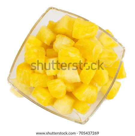 Portion of Sliced Pineapple as detailed close-up shot isolated on white background