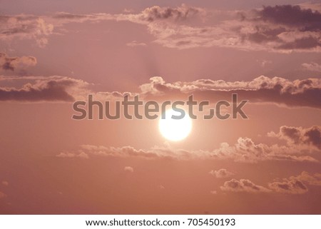 Photo of beautiful orange sunset with dark clouds on sky