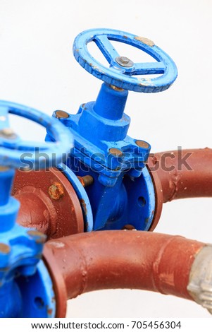 Fire plug with metal flange for water supply.