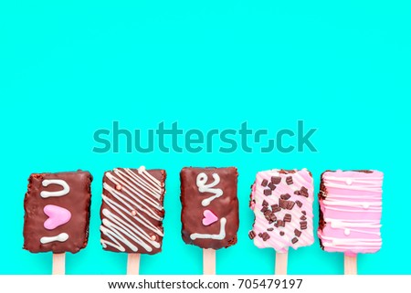 Colorful color cream  pattern  on blue background. Flat lay, top view. Valentine's background