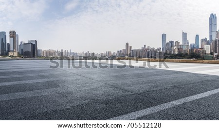 Panoramic skyline and buildings with empty road Royalty-Free Stock Photo #705512128