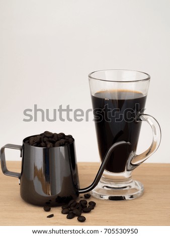 Americano with Coffee Seed and Drip Pot on Wooden in White Background