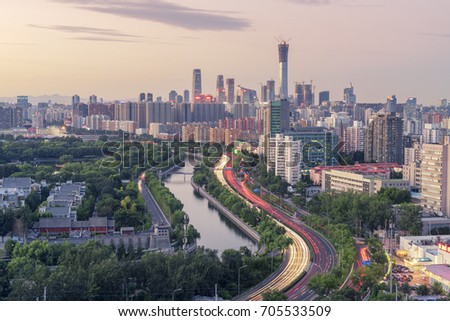 skyline of Beijing.there is a famous park named dragon lake park on the left, in contrast with Morden building on the right.