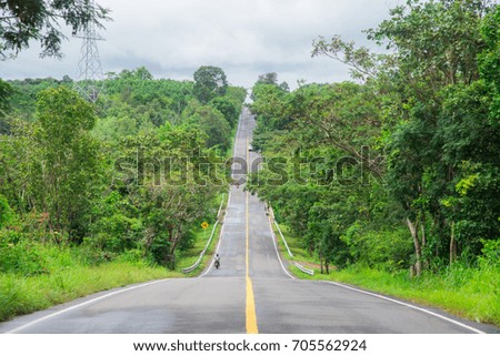 Highway road in thailand.It is a road between the hills.