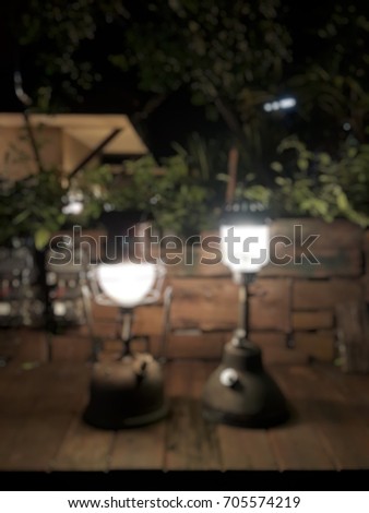 Blurred kerosene oil lantern on wooden table