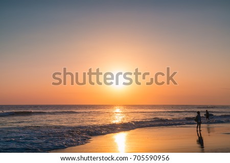 Sunset Waves and Amazing Landscape Ocean. Orange Ocean Beach. Sun rays in a Colorful Sunset Background. Beautiful Sky, Water Sunset Background. Clear Tropical Island View and Sunset Beach Background.