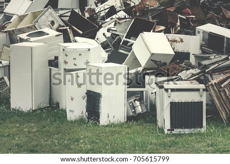 Dump of scrap metal and household appliances Royalty-Free Stock Photo #705615799