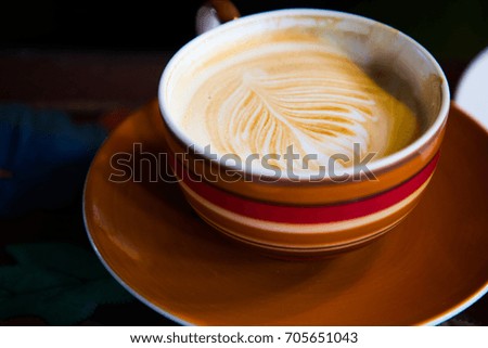 Coffee cup in coffee shop - vintage style effect picture