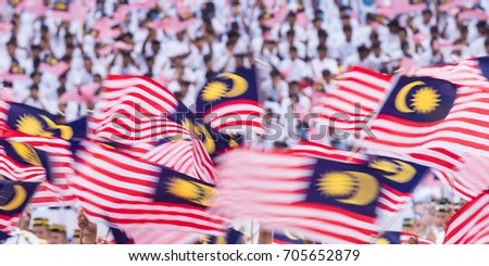 Creative Motion Blur - Waving Malaysia Flags Royalty-Free Stock Photo #705652879