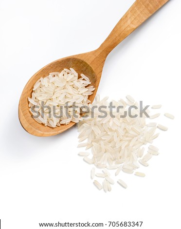 Top view of wooden spoon with parboiled rice isolated on white background. Healthy food. Close up. High resolution product