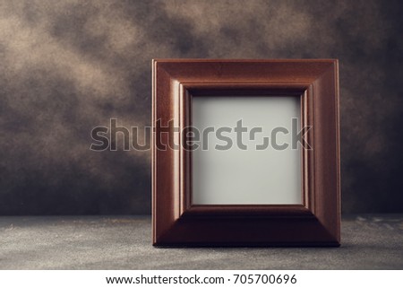 Wooden photo frame on table with copy space - Vintage Filter Processing.