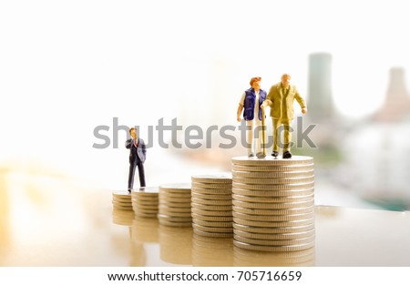 Concept of retirement planning. Miniature people: Old couple figure standing on top of coin stack. Royalty-Free Stock Photo #705716659