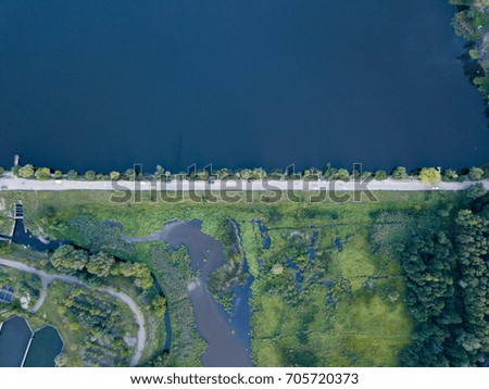 Aerial photography of road with lake