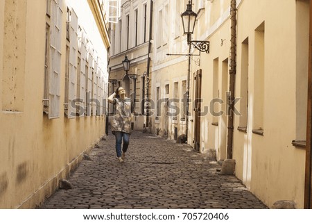 Woman enjoys european streets. Admire of europe tiny streets.