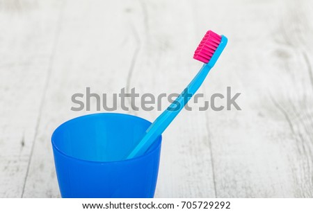New color ultra fine toothbrushes in colorful glasses. Dental Industry. various types of toothbrushes. Beautiful smile concept. Whitening. Tooth care. Teeth healthy concept. Copyspace.