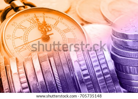 Time is money, business finance concept : Many coins and vintage brass pocket watch, idea of time which is a valuable commodity or resource and it's better to do work or things as quickly as possible.