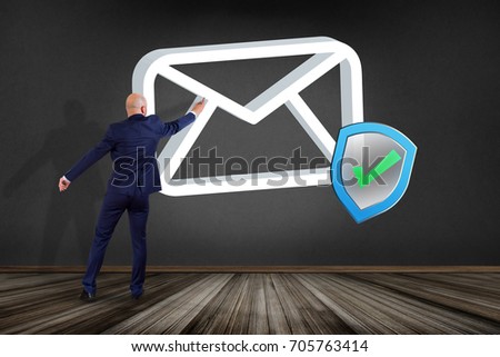 View of a Businessman in front of a wall with Approved and verified Email symbol displayed on a futuristic interface - Message and internet concept