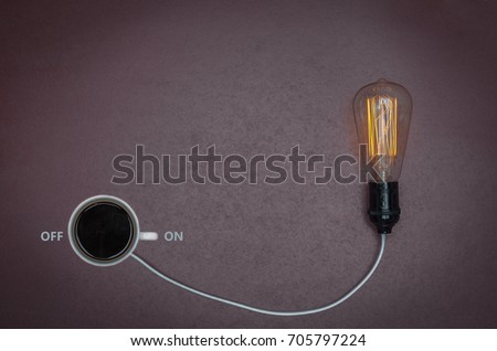 Great concept of caffeine energy, coffee energy. Cup of coffee binding lamp. Royalty-Free Stock Photo #705797224