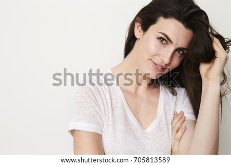 Smiling brunette babe with green eyes, portrait