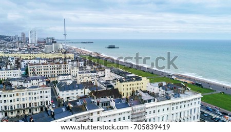 Aerial view of the town of Brighton and Hove towards the beach and the two piers Royalty-Free Stock Photo #705839419