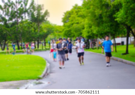 Blurred background of people activities in park.