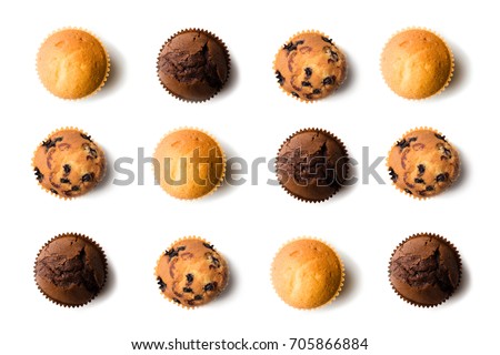 top view of assorted fresh tasty muffins isolated on white Royalty-Free Stock Photo #705866884