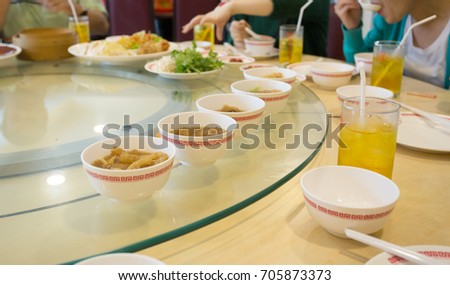 shark fin and fish maw soup in the row on white bowl, Chinese restaurant