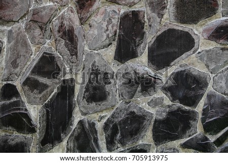 Black light stone texture background.
