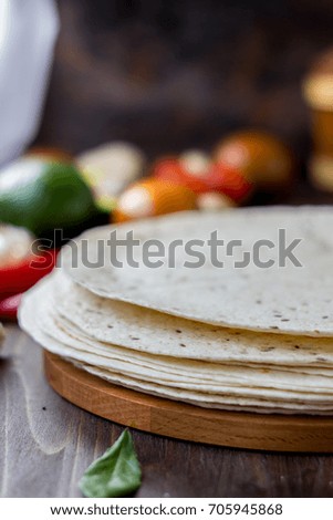 Mexican flatbread tortilla on a wooden background