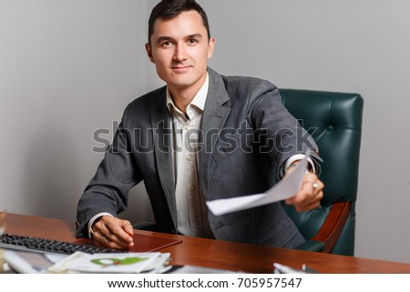 Photo of business brunet with paper