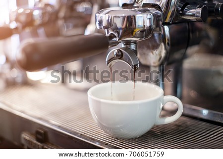 Espresso coffee extraction  Royalty-Free Stock Photo #706051759