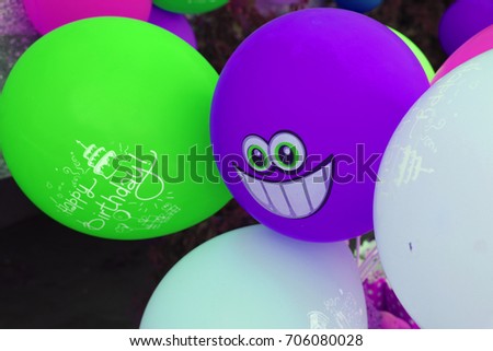 Purple balloon in the shape of a smile