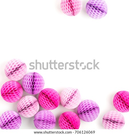 Stylish Frame background with pink and lilac honeycomb balls with copy space for text. isolated on white background. Flat lay, top view.