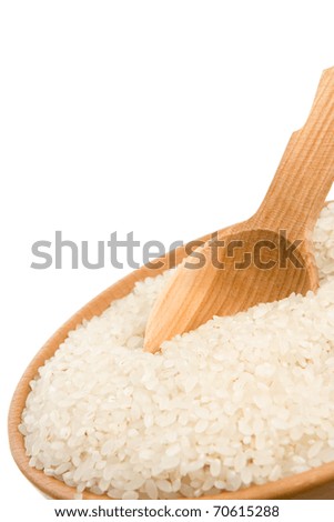 rice in wooden plate and spoon isolated on white background