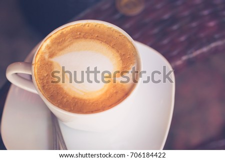 a cup of Capuchino coffee