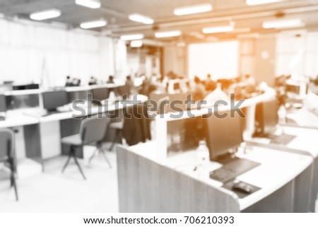 Blur image of office workers use computer in computer lab.(On vintage tone.)