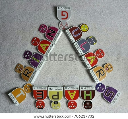 Alphabetical Cartoon's Names S,H,A,P,E,T,R,I,N,G,U,L lying down in the triangular shape on the white background