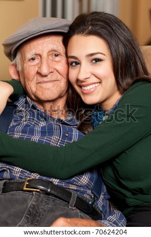 Grandfather and granddaughter lifestyle in a home setting. Royalty-Free Stock Photo #70624204